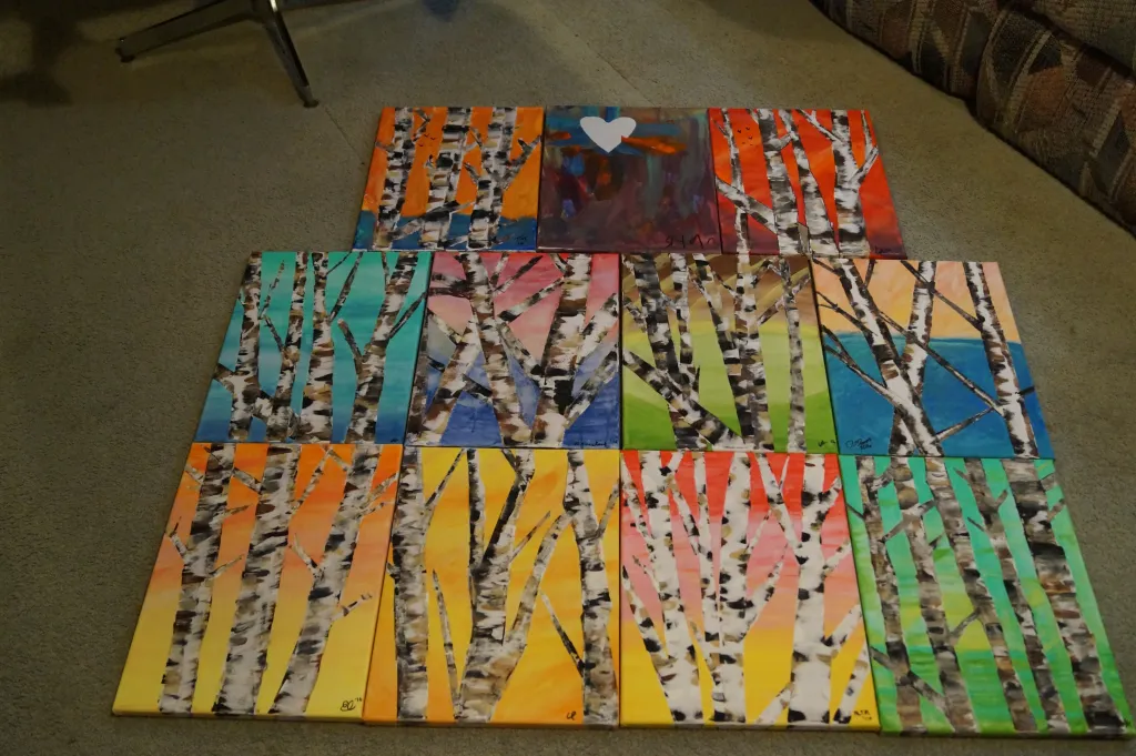 A colourful collection of birch tree paintings