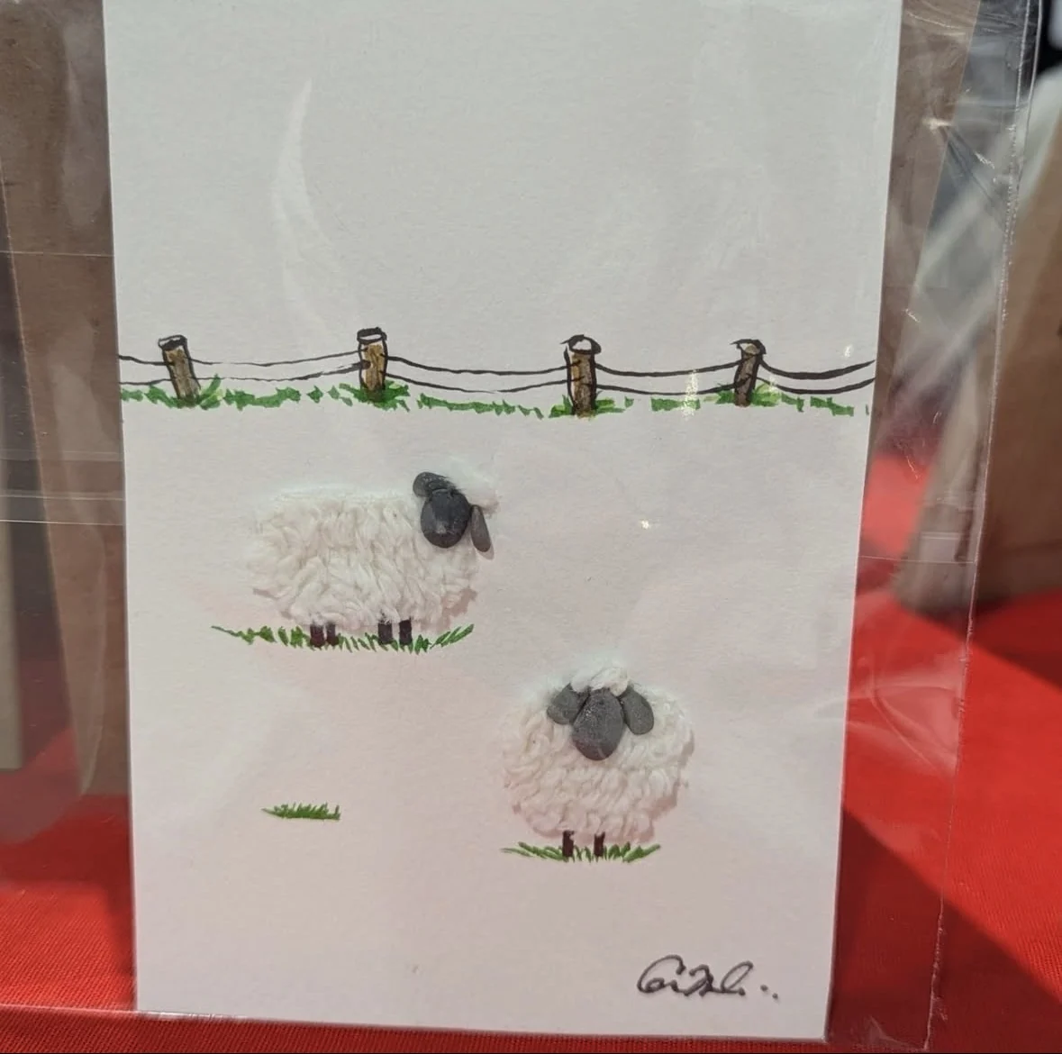 Sheep pebble art with textured white wool